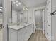 Bright bathroom featuring a double vanity with quartz countertops and a well-lit mirror with modern fixtures at 1212 Belmont Circle Dr, Lancaster, SC 29720