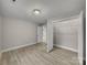 Bedroom featuring hardwood floors, a closet, and neutral paint at 1212 Belmont Circle Dr, Lancaster, SC 29720