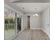 Sunlit dining area with sliding glass doors to a deck offers indoor-outdoor living and wooded view at 1212 Belmont Circle Dr, Lancaster, SC 29720
