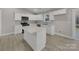 Modern kitchen featuring white cabinets, quartz countertops, and stainless steel appliances, perfect for the cooking enthusiast at 1212 Belmont Circle Dr, Lancaster, SC 29720