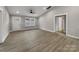 Bright living room showcases an open design, sleek floors and flows into a bright entryway at 1212 Belmont Circle Dr, Lancaster, SC 29720