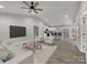 Bright, open-concept living space with modern furnishings flowing seamlessly into a stylish kitchen at 1212 Belmont Circle Dr, Lancaster, SC 29720