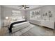 Stylish main bedroom with a large window, ceiling fan, and contemporary decor for a peaceful retreat at 1212 Belmont Circle Dr, Lancaster, SC 29720