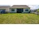 Level backyard with well-maintained lawn and fencing, providing a safe and enjoyable outdoor space at 153 Pampas Pl, Statesville, NC 28625