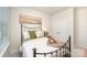 This bedroom features a comfortable bed with stylish decor, complemented by soft natural light and neutral-toned walls at 153 Pampas Pl, Statesville, NC 28625