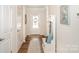 Inviting entryway featuring hardwood floors and a convenient bench with storage at 153 Pampas Pl, Statesville, NC 28625