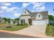 Well-maintained single-Gathering home with green lawn and a two-car garage on a sunny day at 153 Pampas Pl, Statesville, NC 28625