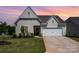 Charming single-Gathering home featuring manicured lawn and attached two-car garage at 153 Pampas Pl, Statesville, NC 28625