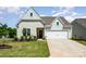 A beautiful home with a well-kept lawn and two-car garage in a Gathering-friendly neighborhood at 153 Pampas Pl, Statesville, NC 28625