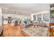 Spacious living area with hardwood floors, seamlessly connected to the kitchen at 153 Pampas Pl, Statesville, NC 28625