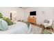 Main bedroom showcasing natural lighting, a comfortable bed with decorative pillows and a full private ensuite bathroom at 153 Pampas Pl, Statesville, NC 28625