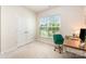 Bright home office with a decorative, comfortable chair and a large window providing natural light and neighborhood views at 153 Pampas Pl, Statesville, NC 28625