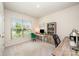 Comfortable home office with natural light from a large window, dual desks, and tasteful decor at 153 Pampas Pl, Statesville, NC 28625