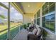 Relax on this cozy porch with comfortable seating, ideal for enjoying peaceful outdoor moments at 153 Pampas Pl, Statesville, NC 28625