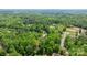 Expansive wooded property featuring a home nestled amongst mature trees and scenic views at 1590 W 7Th St, Newton, NC 28658