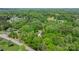 A forested property with a home among mature trees with nearby neighborhood views at 1590 W 7Th St, Newton, NC 28658