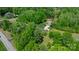 Secluded home with a long driveway nestled within a forest of vibrant green trees at 1590 W 7Th St, Newton, NC 28658
