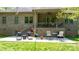 The expansive backyard patio with a seating area is perfect for outdoor lounging and entertainment at 1590 W 7Th St, Newton, NC 28658