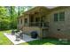The home boasts a brick exterior and a spacious backyard patio with seating for outdoor relaxation at 1590 W 7Th St, Newton, NC 28658