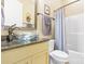 The bathroom features a glass bowl sink and granite countertop vanity, with a shower-tub combo at 1590 W 7Th St, Newton, NC 28658