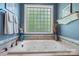 Bathroom featuring a large tub with jets, a frosted window for privacy and tile surround at 1590 W 7Th St, Newton, NC 28658