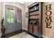 Inviting foyer with a view of the gray glass front door and a stylish bookcase at 1590 W 7Th St, Newton, NC 28658