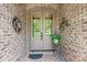 The beautiful front door is a focal point, adding to the home's curb appeal and character at 1590 W 7Th St, Newton, NC 28658