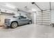 The garage features an epoxy floor, a truck, and automatic doors for convenience at 1590 W 7Th St, Newton, NC 28658