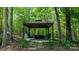 Relaxing outdoor gazebo seating area with beautiful forest views and lush natural surroundings at 1590 W 7Th St, Newton, NC 28658