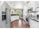 Kitchen with white cabinets, granite counters, and stainless steel appliances at 1590 W 7Th St, Newton, NC 28658