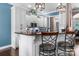 Kitchen featuring white cabinets, dark granite counters, and stainless appliances at 1590 W 7Th St, Newton, NC 28658