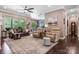 Bright and inviting living room featuring a ceiling fan, neutral paint, and comfortable seating at 1590 W 7Th St, Newton, NC 28658