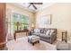 The living room offers natural light, a comfortable sofa, and a workspace perfect for relaxation at 1590 W 7Th St, Newton, NC 28658