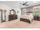A spacious primary bedroom with ample natural light, ceiling fan, and well-appointed furnishings at 1590 W 7Th St, Newton, NC 28658