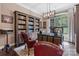 This home office features a large desk and built in book shelves and a large window at 1590 W 7Th St, Newton, NC 28658