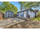 Charming backyard with a shed, patio, and deck, offering a serene space for outdoor enjoyment at 1716 Wickford Pl, Charlotte, NC 28203