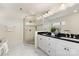 Bathroom boasts a glass enclosed shower, dual sink vanity, and marble floors at 1716 Wickford Pl, Charlotte, NC 28203
