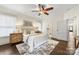 Relaxing bedroom with a ceiling fan, area rug, hardwood floors, and natural light at 1716 Wickford Pl, Charlotte, NC 28203