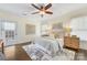 Comfortable bedroom with a ceiling fan, area rug, and french doors at 1716 Wickford Pl, Charlotte, NC 28203