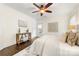 Cozy bedroom with a decorative ceiling fan, hardwood floors, and french doors at 1716 Wickford Pl, Charlotte, NC 28203