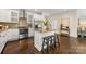 Updated kitchen boasts stainless steel appliances, granite countertops, and kitchen island at 1716 Wickford Pl, Charlotte, NC 28203