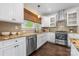 Stylish kitchen with stainless steel appliances, granite countertops and white cabinets at 1716 Wickford Pl, Charlotte, NC 28203