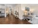 Hallway leading to bright living room and a comfortable seating area at 1716 Wickford Pl, Charlotte, NC 28203