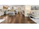 Bright living room with hardwood floors that flow into the kitchen and a comfortable seating area at 1716 Wickford Pl, Charlotte, NC 28203