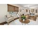 Light-filled living room with cozy seating, hardwood floors, and large windows at 1716 Wickford Pl, Charlotte, NC 28203