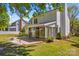 Spacious backyard features a patio, sunroom, and well-maintained lawn at 1807 Sugar Hollow Dr, Charlotte, NC 28214