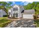 Lovely two-story home with an attached garage, driveway, and manicured lawn at 1807 Sugar Hollow Dr, Charlotte, NC 28214
