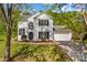 Beautiful two-story home with black shutters, and attached two-car garage at 1807 Sugar Hollow Dr, Charlotte, NC 28214