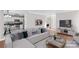 Comfortable living room with a large sectional sofa and open floor plan at 1807 Sugar Hollow Dr, Charlotte, NC 28214