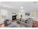 Bright living room with fireplace, plush seating, and plenty of natural light at 1807 Sugar Hollow Dr, Charlotte, NC 28214